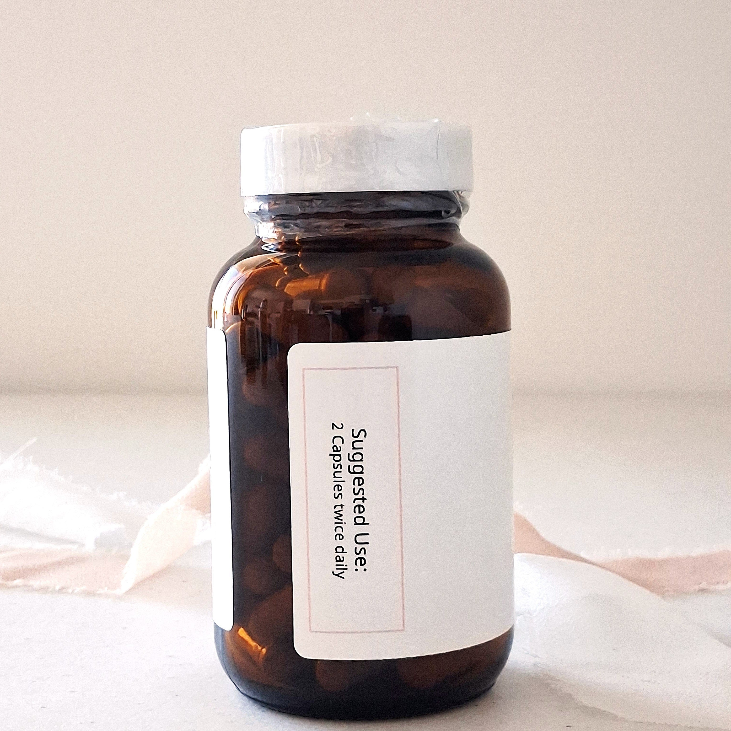 Brown glass bottle with a white label on a light background